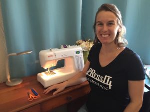 PRess It Wristwraps founder Rachel Baird poses with her sewing machine