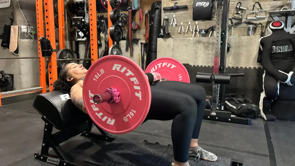 Naomi Greaves using the RitFit PHM01 Hip Thrust Machine